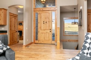 Quality Front Door with distinctive wood trim in a new home construction of a single family home in Billings MT, a Safe and Secure kid friendly neighborhood.